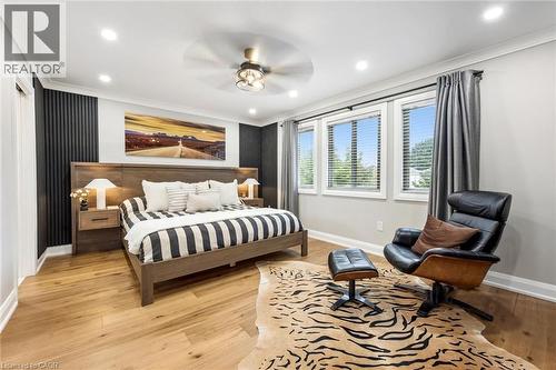 Recessed lighting, wood-finish flooring, ceiling fan, and multiple windows with blinds - 1261 Stephenson Drive, Burlington, ON 