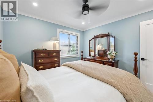Recessed ceiling lighting, ceiling fan with light, crown molding, white trim, and a built-in window - 1261 Stephenson Drive, Burlington, ON 