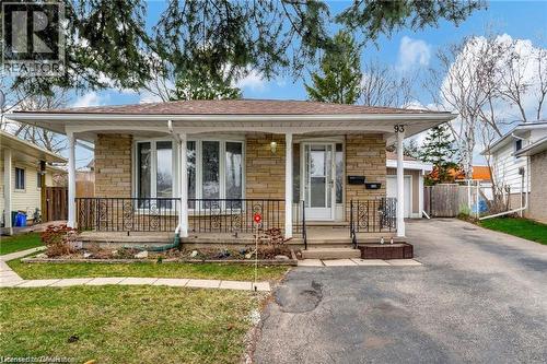 Stone veneer exterior with a covered porch and bay window - 93 Robertson Crescent, Kitchener, ON 