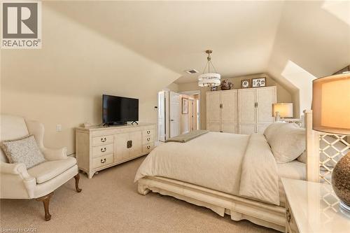 Walk-in closet, ensuite, luxury carpeting, recent light fixture. - 3040 First Street, Burlington, ON 