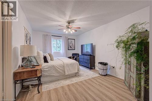 Wood-finish flooring with white walls and a ceiling fan - 317 Christopher Drive, Cambridge, ON 