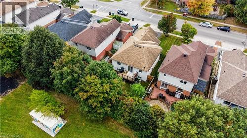 Two-story residence with a brown shingled roof and light-colored siding - 317 Christopher Drive, Cambridge, ON 