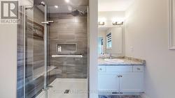 Glass shower in ensuite. - 