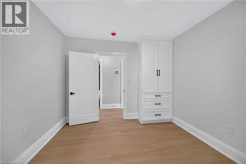 White built-in cabinetry with black hardware - 50 West 4Th Street, Hamilton, ON 