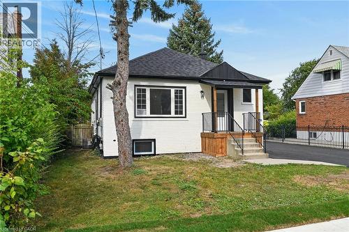 White brick exterior with black trim windows - 50 West 4Th Street, Hamilton, ON 