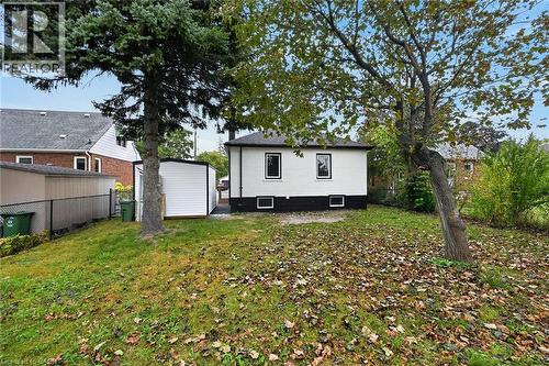Expansive yard space with mature trees and a detached shed - 50 West 4Th Street, Hamilton, ON 