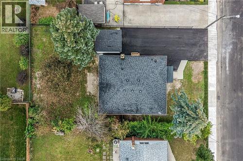 Asphalt shingle roof, paved driveway, concrete walkway, mature trees - 50 West 4Th Street, Hamilton, ON 