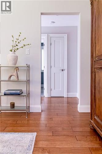 Wood-finish flooring throughout the hallway - 896 Eagle Drive, Burlington, ON 