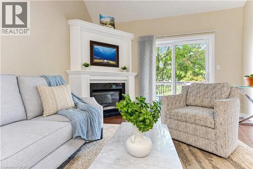Gas fireplace and sliding doors to upper deck. - 222 Chestnut Hill Crescent, Kitchener, ON 