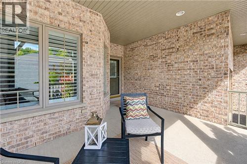 Protected from the elements front porch seating area. - 222 Chestnut Hill Crescent, Kitchener, ON 