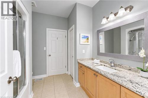 Main floor bathroom with access to primary bedroom and main hallway. - 222 Chestnut Hill Crescent, Kitchener, ON 