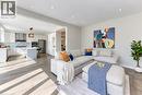 Recessed lighting throughout, wood-finish flooring, and white kitchen cabinetry - 365 Woolwich Street, Waterloo, ON 