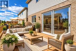 Expansive wooden deck featuring multiple defined zones, brick and siding exterior, and sliding glass doors - 