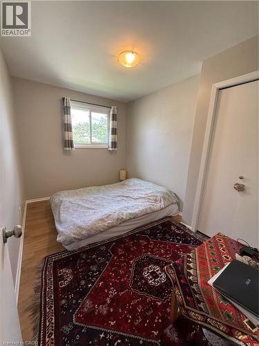 Wood-finish flooring with a window and a ceiling-mounted light fixture - 281 Toll Gate Boulevard, Waterloo, ON 