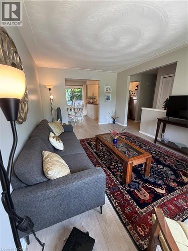 Wood-finish flooring throughout, providing a cohesive aesthetic - 281 Toll Gate Boulevard, Waterloo, ON 