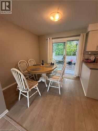 Wood-finish flooring throughout, neutral wall paint, and overhead lighting - 281 Toll Gate Boulevard, Waterloo, ON 
