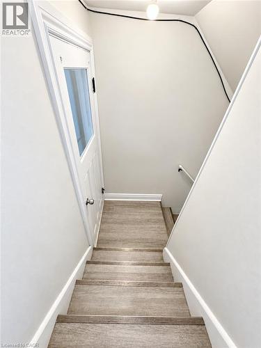 Wood-finish flooring on stairs - 84 Weber Street S, Waterloo, ON 