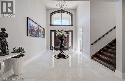 Foyer view of double doors and distinctive upper window - 61 Schweitzer Street, Kitchener, ON 