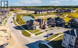 Aerial view of residential area featuring a large body of water - 