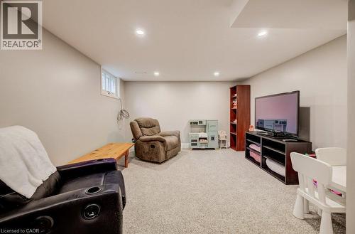 Carpeted room with recessed lighting, an egress window, and light-toned walls - 37 Margaret Avenue N, Waterloo, ON 