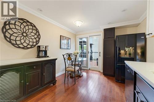 Kitchen area with patio door to large deck. - 77 Yellow Birch Drive, Kitchener, ON 