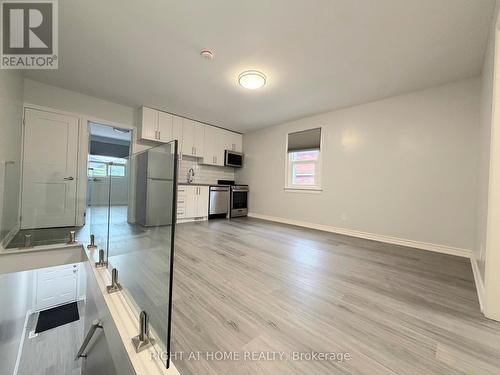 UPPER - 408 STRATHMORE BOULEVARD , Toronto, Ontario M4C 1N5 4