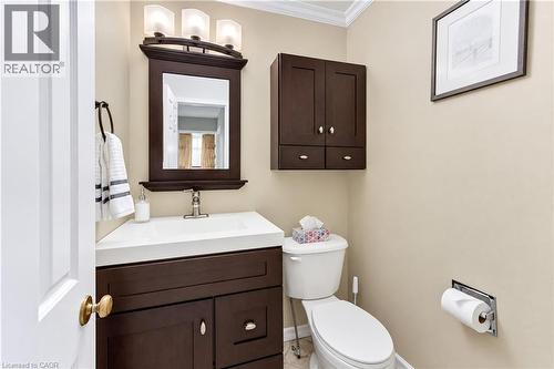 Dark wood-finish vanity with integrated sink - 104 Deerwood Crescent, Kitchener, ON 