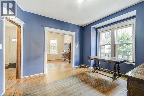 Hardwood flooring, painted walls, and window trim details - 11 Elm Street, Hamilton, ON 