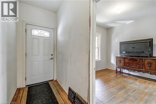 Entry door with decorative glass inserts and wood-finish flooring - 11 Elm Street, Hamilton, ON 