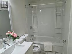 White vanity with an integrated sink and chrome faucet - 