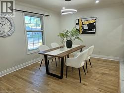 Crown molding, recessed lighting, wood-finish flooring, and a single-pane window - 