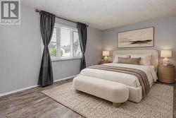 Virtually staged primary bedroom - 