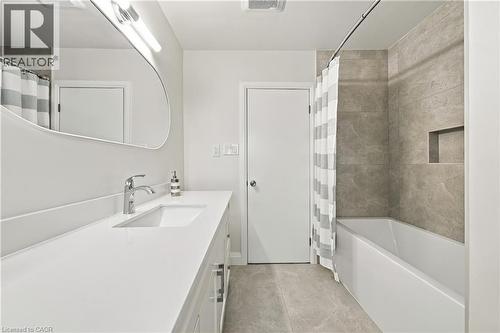 Integrated vanity with an undermount sink and polished chrome faucet - 662 Dynes Road, Burlington, ON 