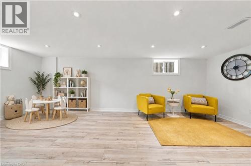 Recessed lighting, light wood-finish flooring, white walls, and multiple windows - 662 Dynes Road, Burlington, ON 