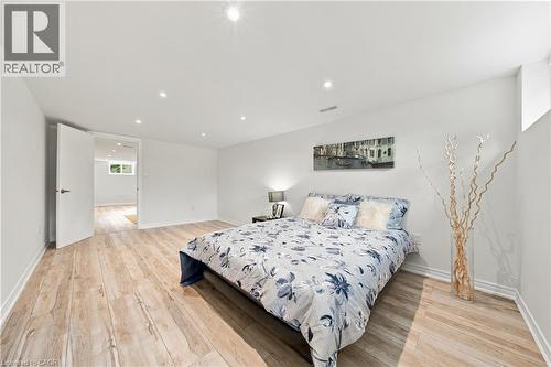 Recessed lighting illuminates wood-finish flooring - 662 Dynes Road, Burlington, ON 
