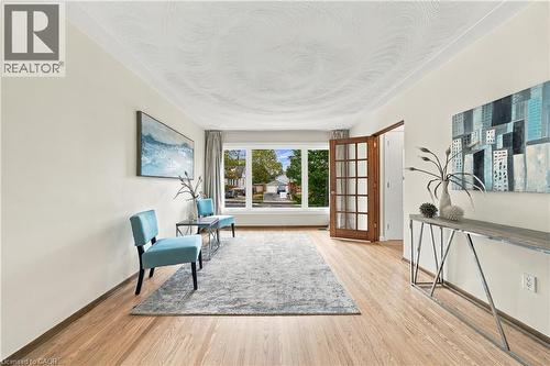 Light wood-finish flooring with neutral wall tones - 662 Dynes Road, Burlington, ON 