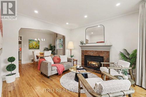 Cozy up by the fire in this welcoming living room - 51 Merritt Avenue, Ottawa, ON 