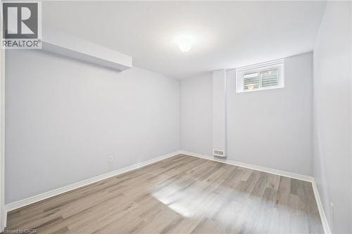 Light gray walls with wood-finish flooring - 233 Dearborn Boulevard, Waterloo, ON 