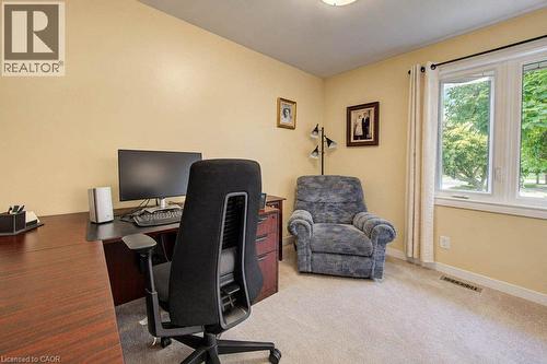 Soft carpet flooring with a window providing natural light - 1370 Thorman Place, Cambridge, ON 