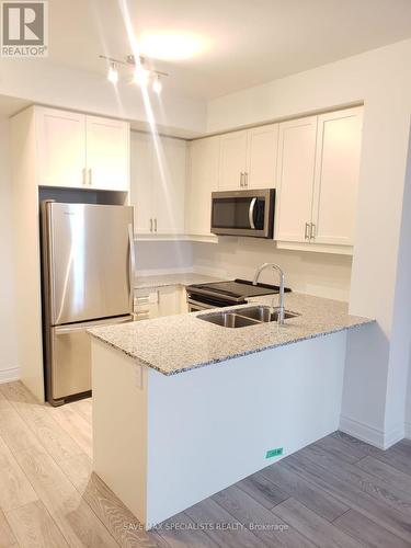 401 - 1050 MAIN STREET , Milton, Ontario L9T 9M3 2