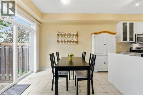 Sliding glass door, tiled flooring & microwave - 1076 Ryckman Common, Burlington, ON 