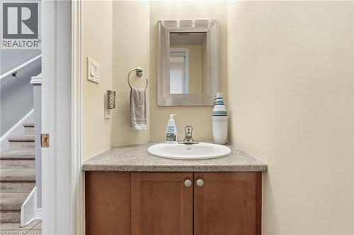 Corner vanity with a built-in sink and a light-toned countertop - 1076 Ryckman Common, Burlington, ON 