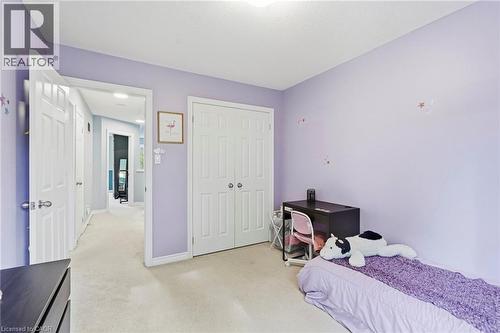 Plush carpet flooring, light purple wall finishes, and white trim - 1076 Ryckman Common, Burlington, ON 
