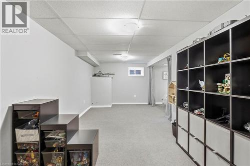 Finished lower level with neutral carpeting - 1076 Ryckman Common, Burlington, ON 