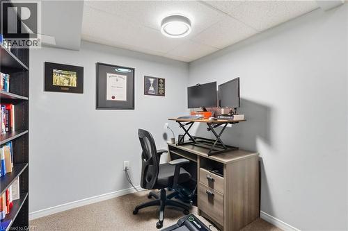 Built-in shelving, neutral wall paint, and recessed ceiling lighting - 1076 Ryckman Common, Burlington, ON 