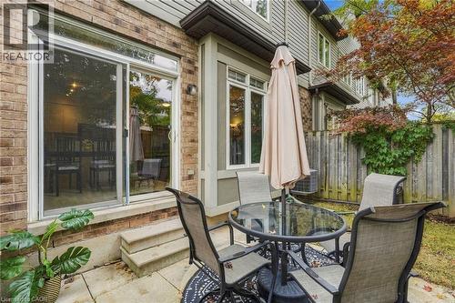 Brick exterior with sliding glass patio door - 1076 Ryckman Common, Burlington, ON 