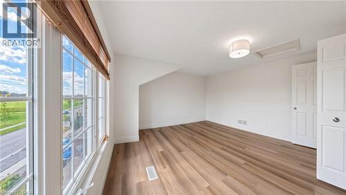 Expansive multi-pane window with wood-finish blinds - 250 Parkvale Drive, Kitchener, ON 
