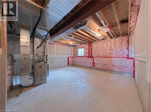 Unfinished basement with concrete flooring and exposed ceiling joists - 250 Parkvale Drive, Kitchener, ON 