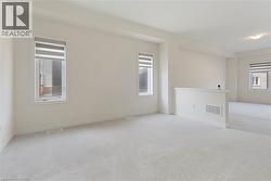 Carpeted empty room with baseboards - 