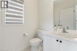 Bathroom featuring vanity and toilet - 